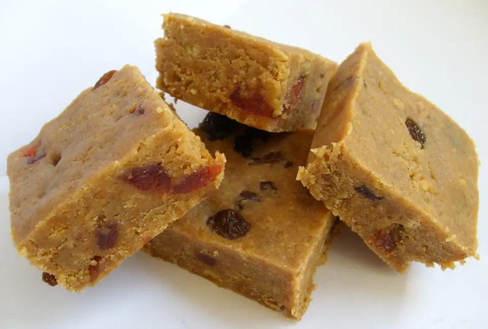 Squares of homemade fudge studded with dried fruit.