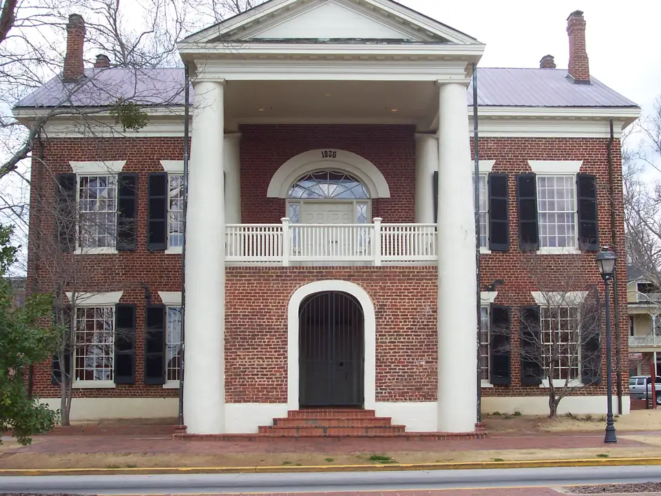 The columned portico of Dahlonega's 1836 courthouse, now the Gold Museum, on a grey winter day.
